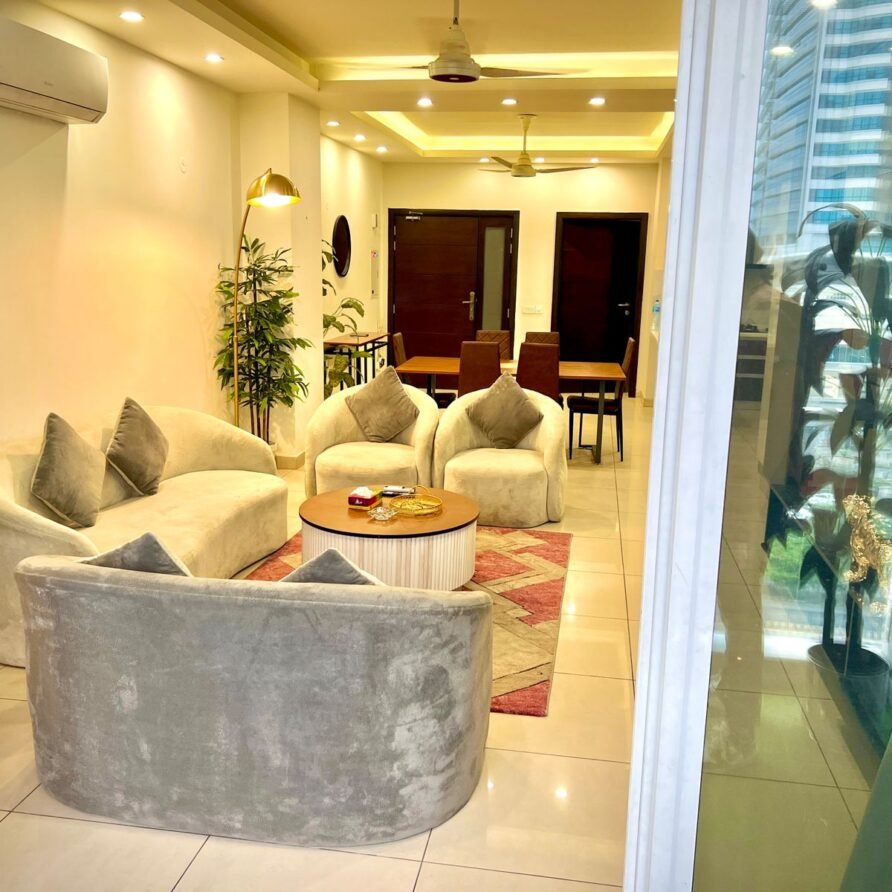 Stylish velvet sofa and city view window in luxury Airbnb apartment, Elysium Tower Islamabad