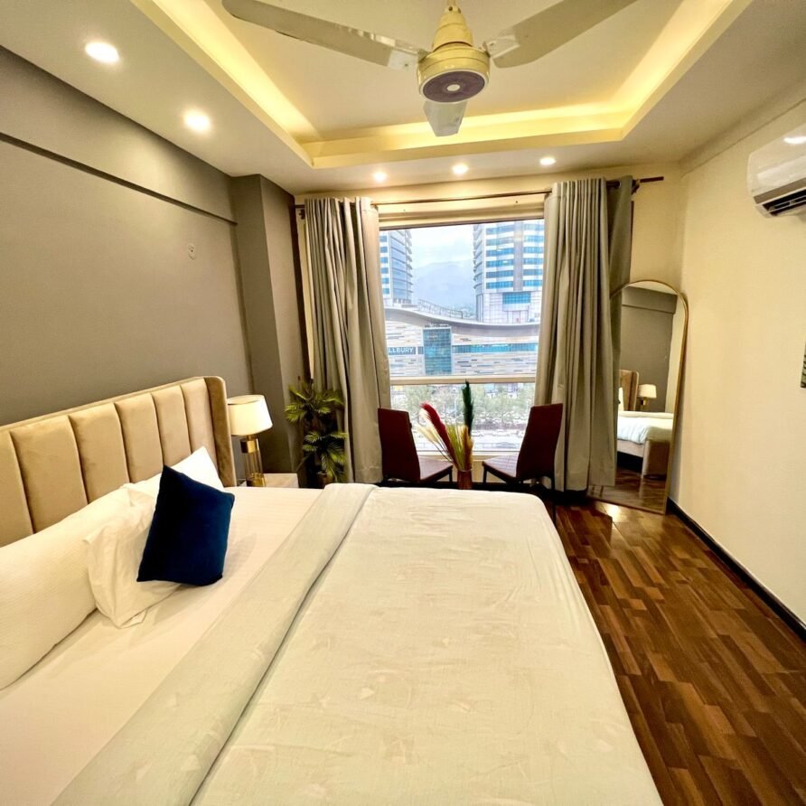Plush master bedroom with warm lighting in top-rated Airbnb apartment near Centaurus Mall