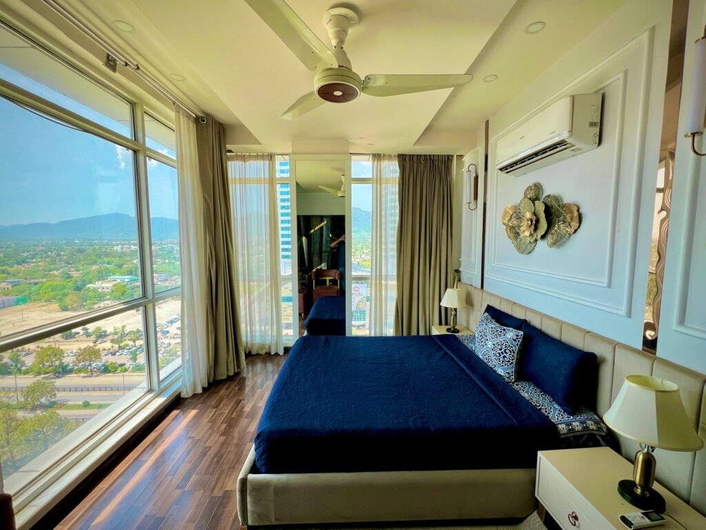 Corner suite with panoramic windows and warm, modern decor