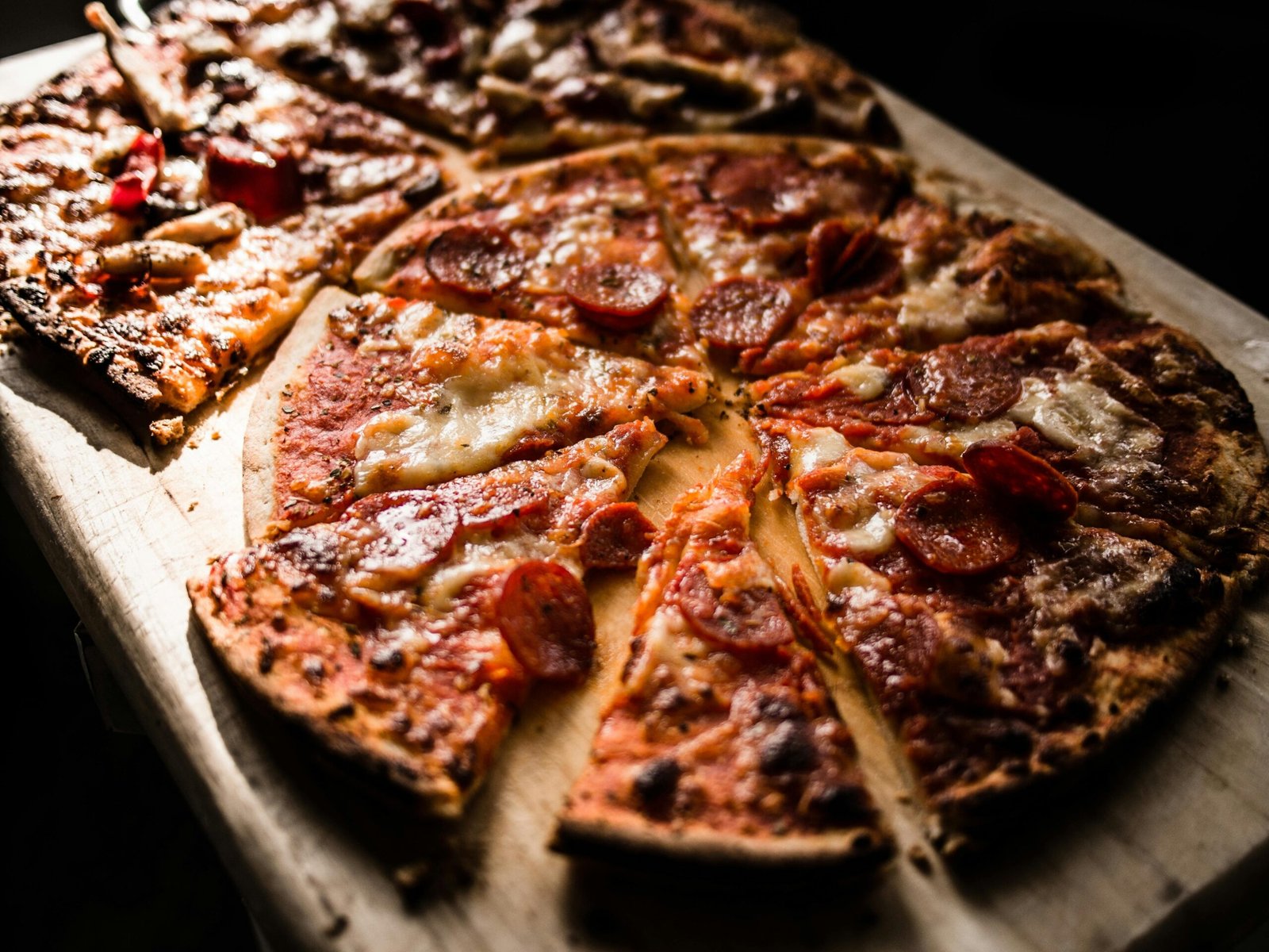 Pizza slice on board